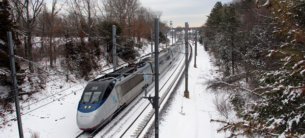 Photo of the Acela passing through Charlestown in winter