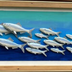 Image of wooden diorama of river herring