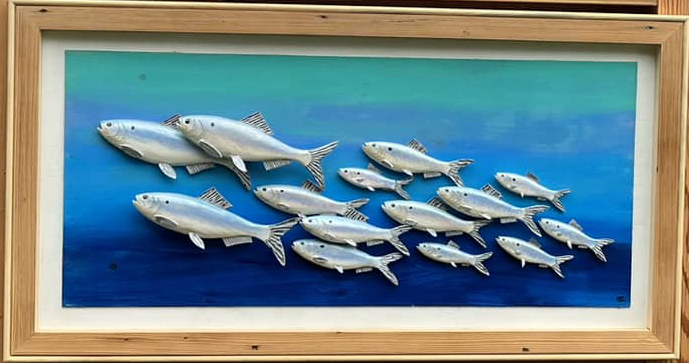 Image of wooden diorama of river herring