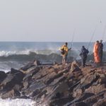 Photo of people fishing on the Charlestown Breachway