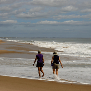Photo of two women walking on East Beach